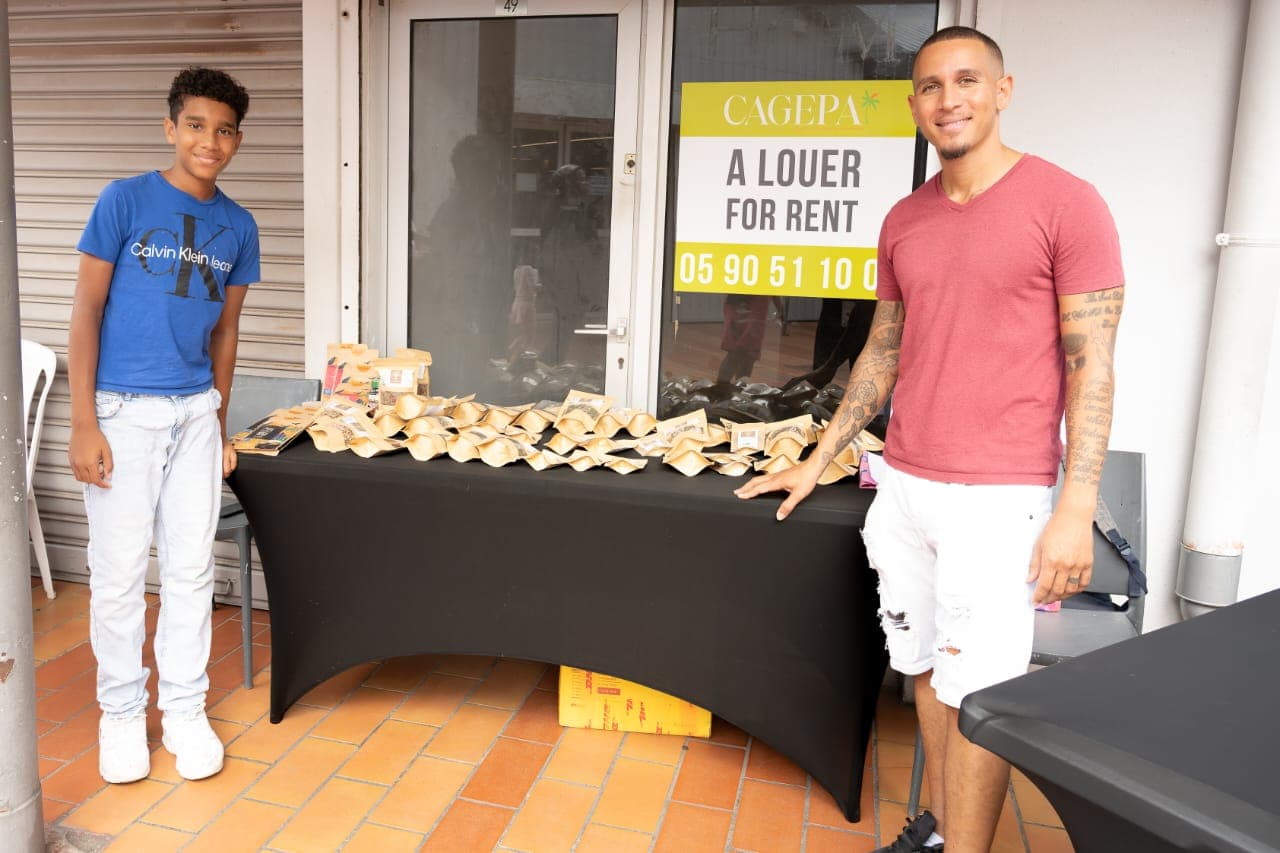 Kenan at a Vital Healing SXM market stand